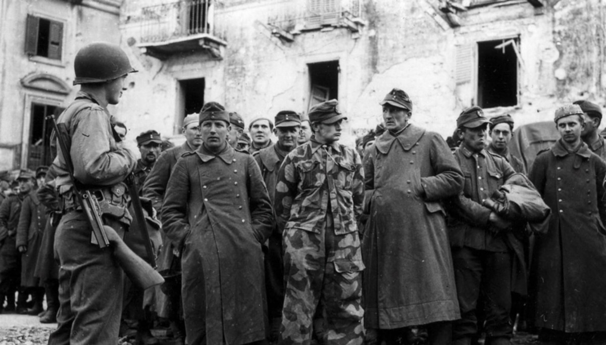German POWs guarded by an American GI