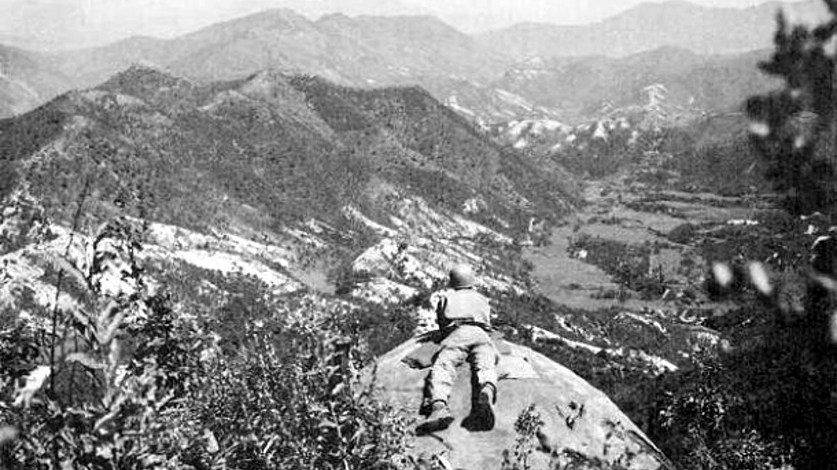 A Soldier from the 1st Cavalry Division, mans an observation post overlooking North Korean-controlled territory on the Pusan Perimeter, in September 1950.