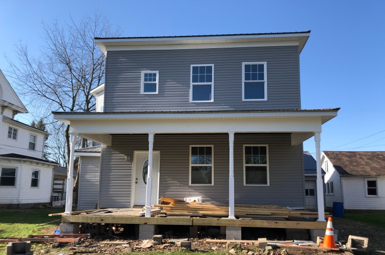 The Walton House on Fair Avenue NW undergoing repairs, April 2022.