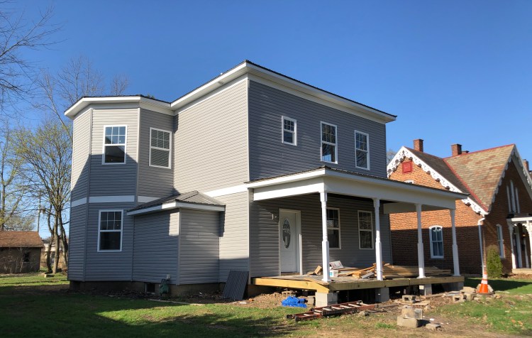 The Walton House on Fair Avenue NW undergoing repairs, April 2022.