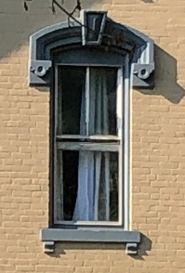 Detail of the hooded windows on the Stow House, 2022.
