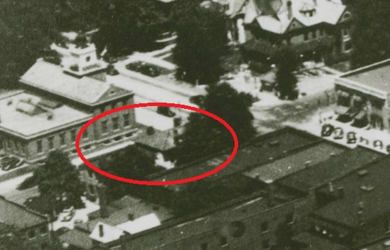 The Hay House, and its hipped roof, partially visible in this 1930s aerial photograph of New Philadelphia. (Source: ohiomemory.org)