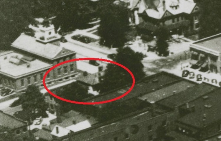 The Hay House, and its hipped roof, partially visible in this 1930s aerial photograph of New Philadelphia. (Source: ohiomemory.org)