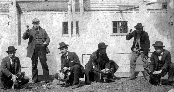 Early 20th century photograph of men with fighting roosters. (Source: phoebusmemories.org)