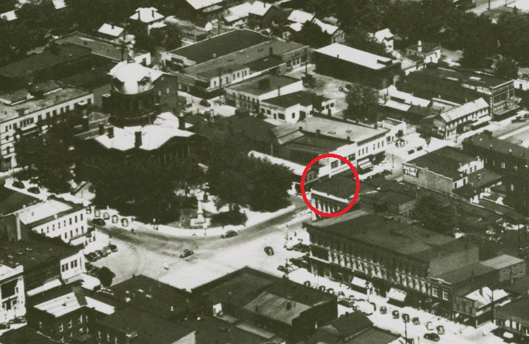 Photo of downtown New Philadelphia, Ohio taken shortly after the removal of the original "Welcome to Our City" sign on top of the Alexander building (circled), c. 1940. (Source: ohiomemory.org)
