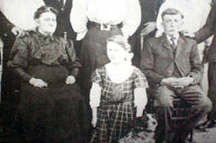 Photograph believed to be of Elizabeth and John Grimm (seated) and their youngest daughter Jessie, c. 1910. (Source: ancestry.com)