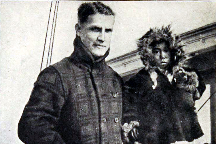 Fred Maurer, with an Inuit child, on the deck of one of the rescue ships after their rescue from Wrangel Island, September 1915. (Source: "The Adventure of Wrangel Island" by Vilhjalmur Stefansson via archive.org)