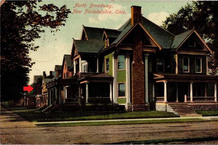 The Bates house (red arrow) as seen in this early 1900s postcard of homes on North Broadway, New Philadelphia, Ohio. (Source: ebay.com)