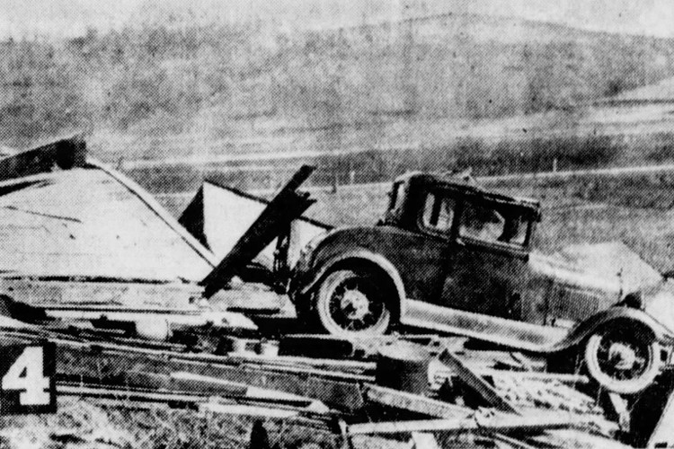 A 1928 Ford surrounded by debris that was once a garage, April 1940. (Source: newspapers.com)