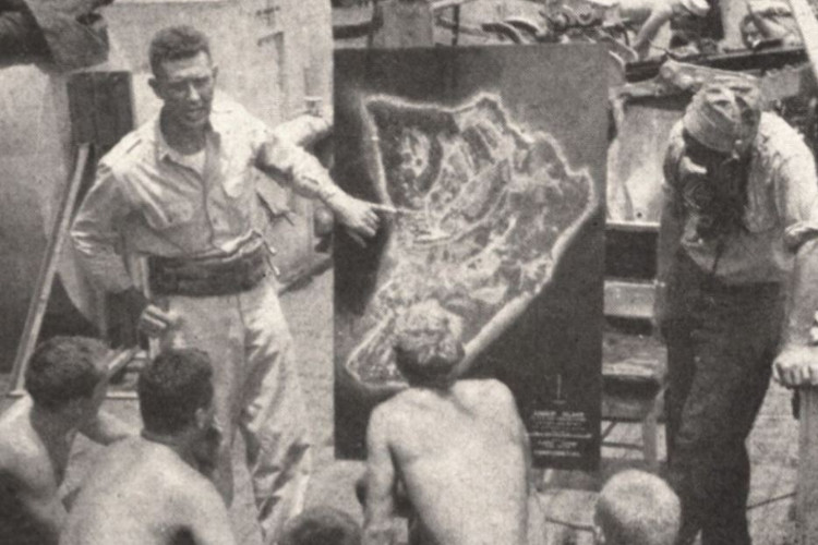 Men of the 322nd Regimental Combat Team being briefed before the invasion of Angaur, 1944. (Source: cgsc.contentdm.oclc.org)